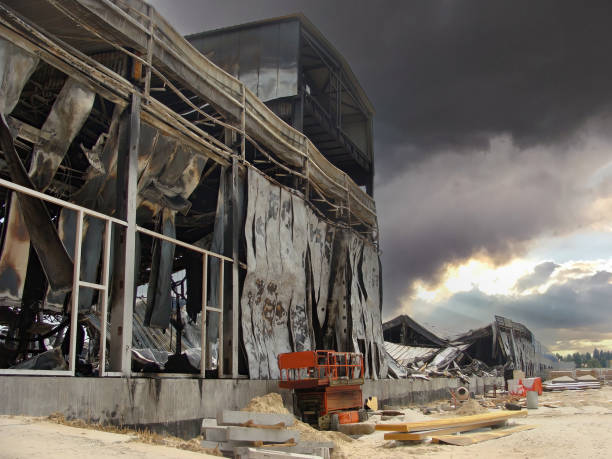istock The aftermath of a warehouse fire, charred and destroyed structures, sandwich panel walls. Burnt Scissor lifts 1495671664