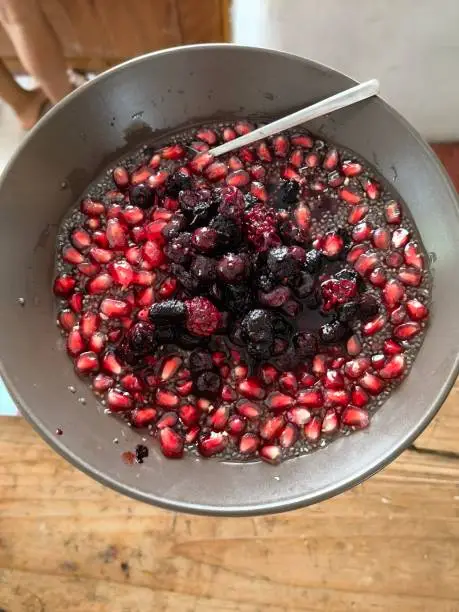Delicious homemade dessert bowl prepared with local seasonal food in the south of China. The dessert includes local red berries and seasonal grenades, mixed with homemade berries jam and jelly.