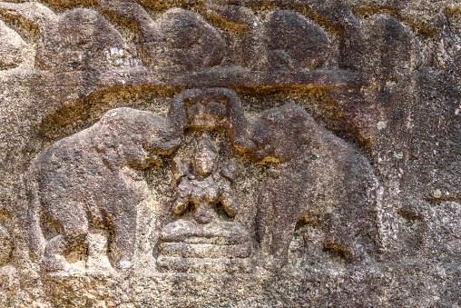 A stone relief showing two elephants on the end of the Gal Pota, Polonnaruwa. The Gal Pota (Stone Book) is a large stone measuring 9 metres by 1.5 metres by 60 centimetres covered with an inscription extolling the virtues of King Nissanka Malla. Polonnaruwa, the second most ancient of Sri Lanka's kingdoms, was first declared the capital city by King Vijayabahu I, who defeated the Chola invaders in 1070 CE to reunite the country under a national leader.