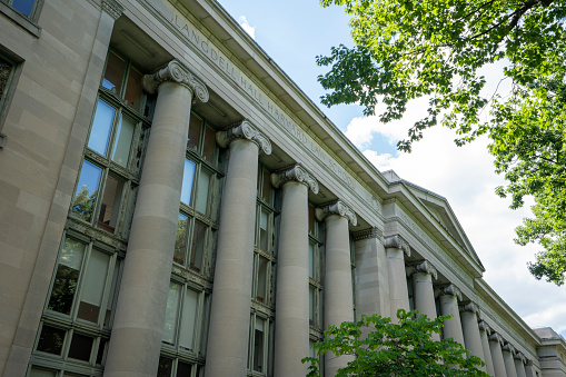 Cambridge, MA, USA - June 29, 2022: Langdell Hall, the largest building of Harvard Law School (HLS) and home to the school's library, on the Harvard University campus in Cambridge, Massachusetts.
