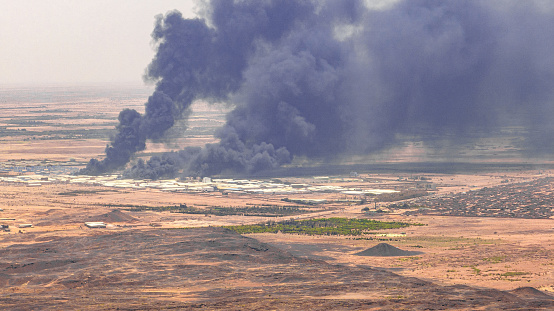 ‏Aerial photo of a group of huge crop and food stores in the west of Omdurman city looted and burned on June 3, 2023