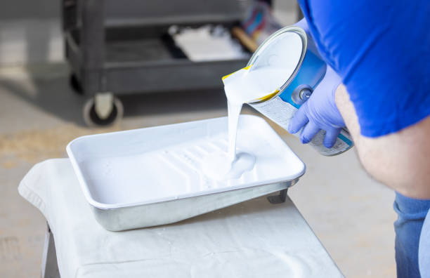 istock A person pouring primer paint into a paint tray 1495682602