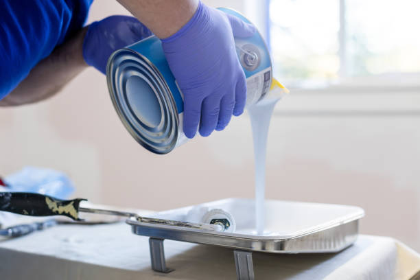 istock A person pouring paint to a paint tray 1495682610