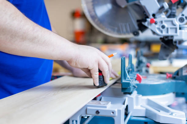 istock A man measuring a laminate floor plank 1495682893