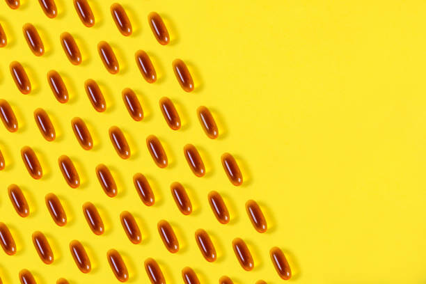 istock Fish Oil Capsules On a Yellow Background. 1495684085
