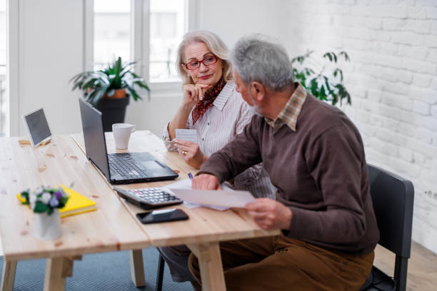 istock A senior couple is working at home while making plans for online shopping. 1495684391