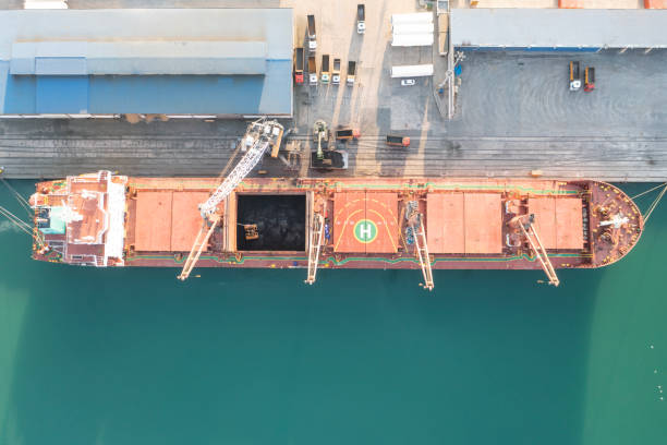 istock Unloading coal in an international port. 1495684421