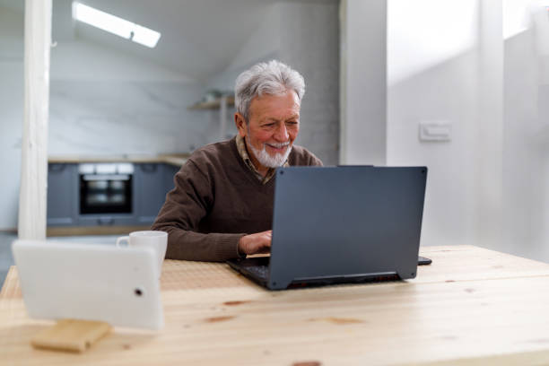 istock A senior man is working at home while making plans for online shopping. 1495685580