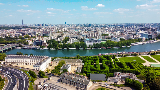Aerial panorama of Paris with Eiffel tower and National domain of Saint-Cloud  in right lower corner. Seaine river - day view  in summer from drone!  Piece of Saont-Cloud bridge and som highway