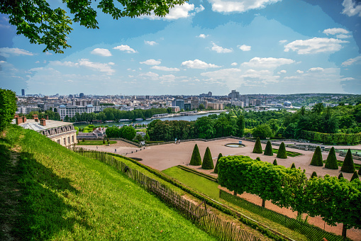 Amazing sunny view in National Domain of Saint-Cloud  (park) and Seine river in distance