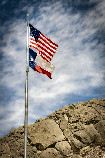 USA Flag in the mountains. Green meadow contrasting with the colors.