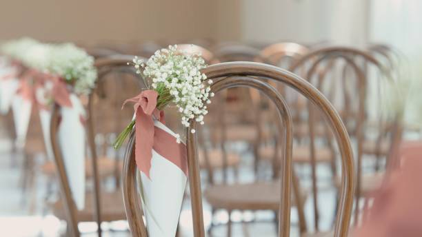 istock Wedding chairs decoration flowers in a hall. 1495686103