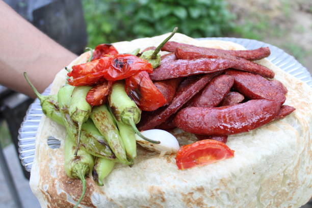 delicious grilled sausage. tomatoes and peppers.Barbeque grate diet concept closeup. Delicious picnic party background. delicious grilled sausage. tomatoes and peppers.Barbeque grate diet concept closeup. Delicious picnic party background. turkish sausage stock pictures, royalty-free photos & images