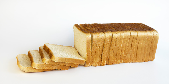 Sliced white toasted bread on a white background. Concept of making breakfast