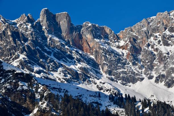 istock Snowcapped mountains in the sun in Austrian alps against blue sky 1495694437