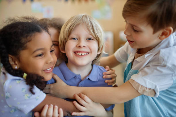 istock Children embracing happily playing together 1495695018