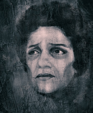 The face of a dark-skinned middle-aged woman. Illustration of sadness, loss. Close-up