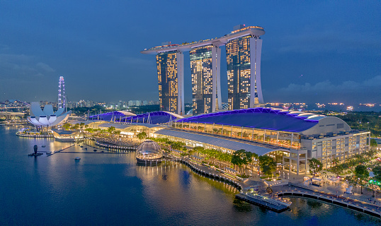 Aerial view of Singapore cityscape at dusk. Landscape of Singapore Marina bay with modern buildings and skyscrapers at night