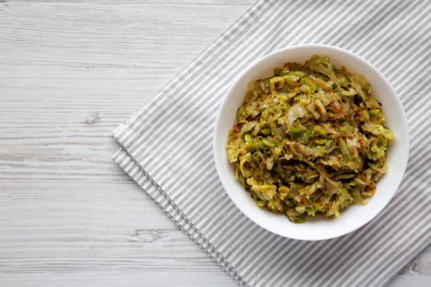 istock Homemade Irish Sauteed Cabbage in a Bowl, top view. Flat lay, overhead, from above. Space for text. 1495696089