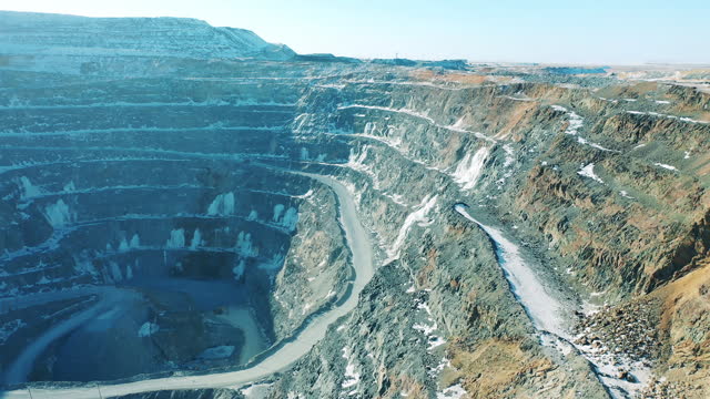 Hillsides of an open-cut mine filmed from above