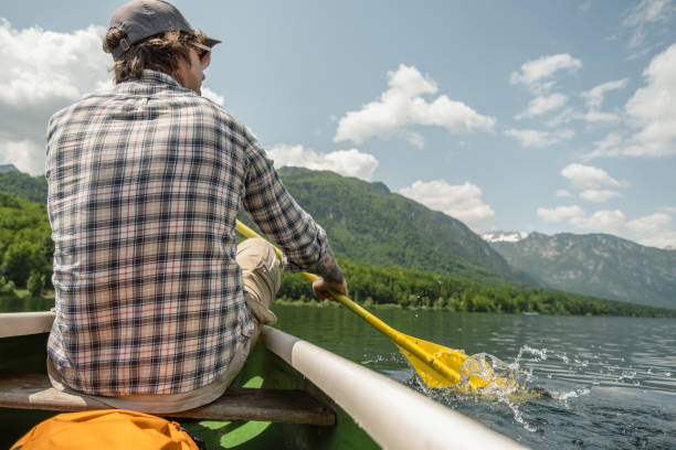 istock A man in a canoe on a mountain lake. 1495701921