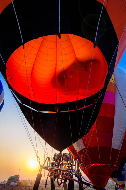 istock hot air balloon burning in sunset sky 1495703661