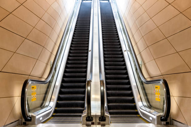 istock Modern escalator at railway station, background with copy space 1495709932