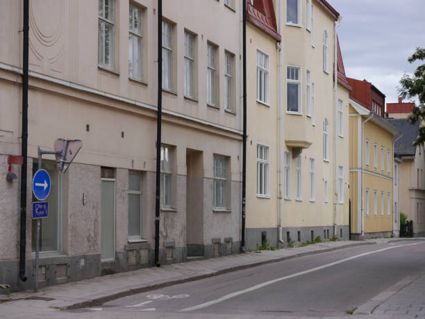 istock A empty road amidst buildings in city 1495715005