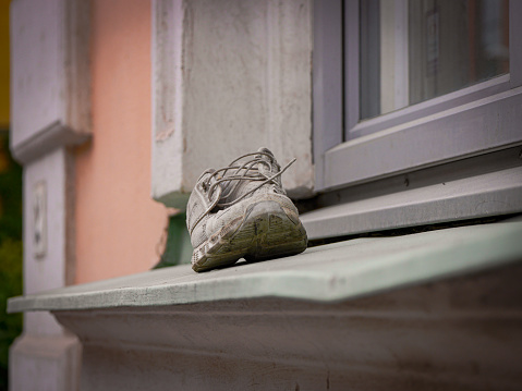 close up of a shoe on a windowsill