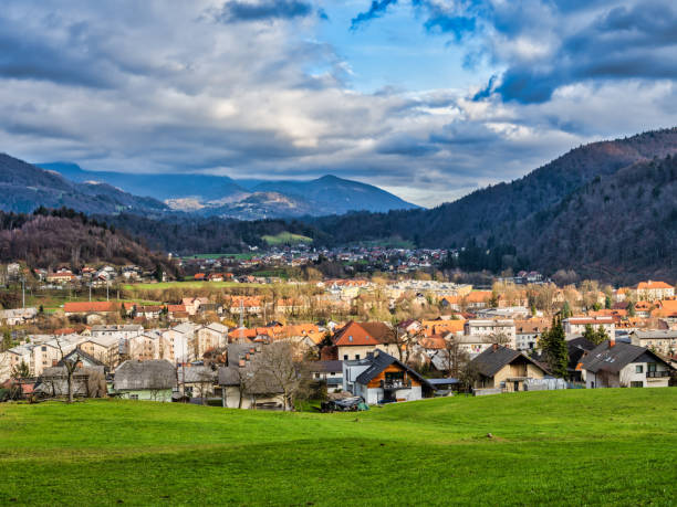 istock Kamnik village valley, lush green grass field and mountain in the background during a cloudy afternoon, Kamnik, Slovenia 1495720708