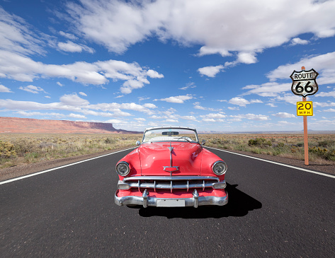 Vintage convertible oldtimer driving through National Park USA on Route 66