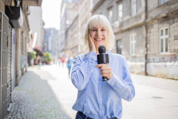 istock Young TV reporter broadcasting live 1495724709