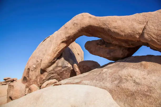 Iconic arch rock formation in Joshua Tree National Park California