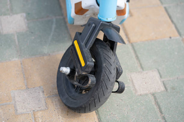 istock Broken Electric Scooter Front Wheel Close-up 1495731527