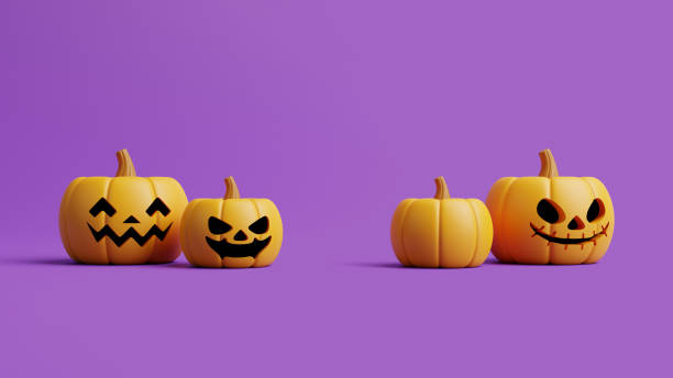 istock Jack-o-Lantern pumpkins on purple background 1495733583