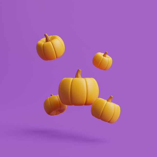 istock Jack-o-Lantern pumpkins floating on purple background 1495733678