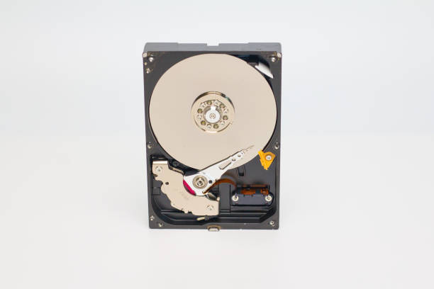 istock Disassembled hard drive from the computer, hdd with mirror effect. Opened hard drive from the computer hdd disk drive with mirror effects. Part of computer pc, laptop. 1495737047