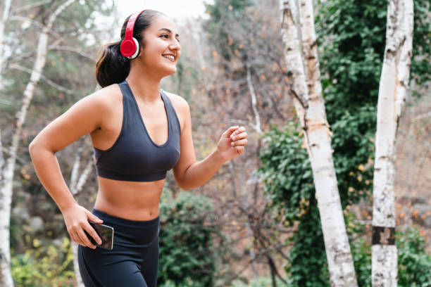 istock Morning workout vlogging using modern technology. young woman in sports suit warming up before jogging 1495738136