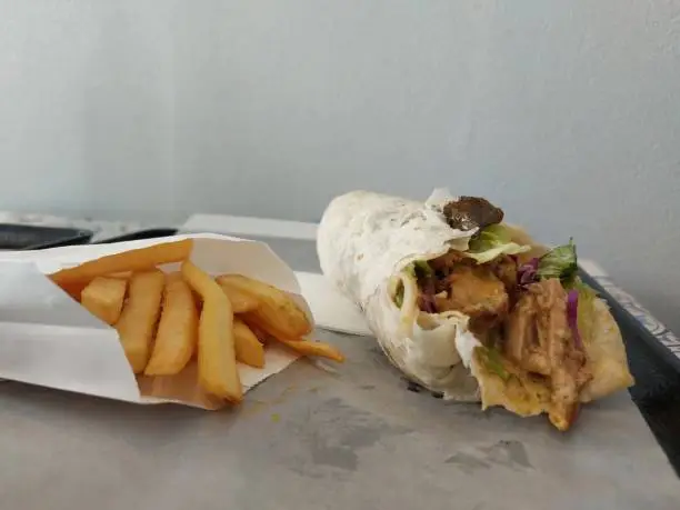 Photo of shawarma with the addition of french fries