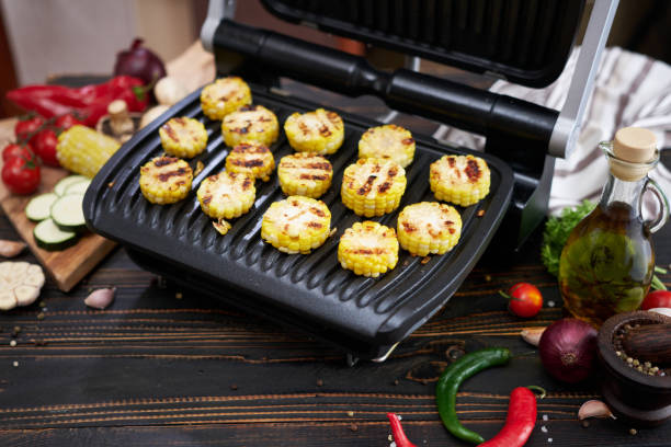 istock cooking at home on electric grill - sliced corn cobs 1495740122