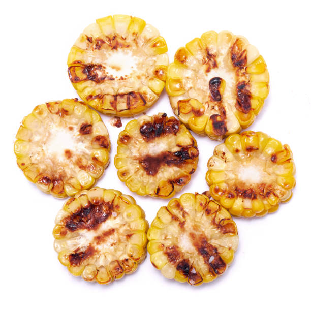 istock Grilled Slices of corn cobs with stripes from a grill isolated on white background 1495740127