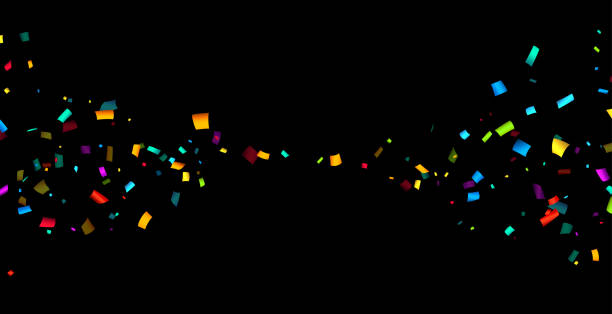 istock Colorful cut out ribbon confetti on black background. 1495740577