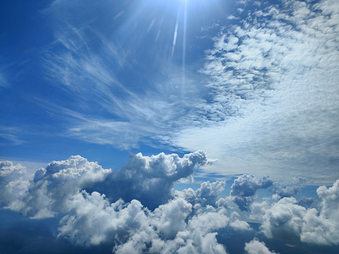 Beams of sun light through breaking dark clouds