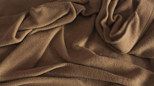 istock background and texture of a brown cotton hotel blanket 1495749379
