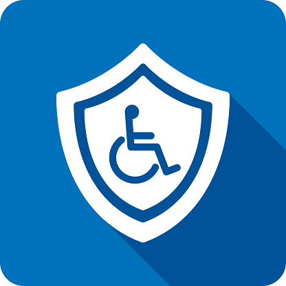 Vector illustration of a shield with wheelchair icon against a blue background in flat style.
