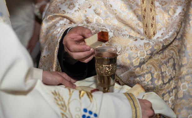 istock consecrated bread into the consecrated wine  in Romania 1495752534