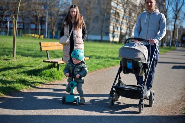 istock Toddler on scooter with his parents 1495762455