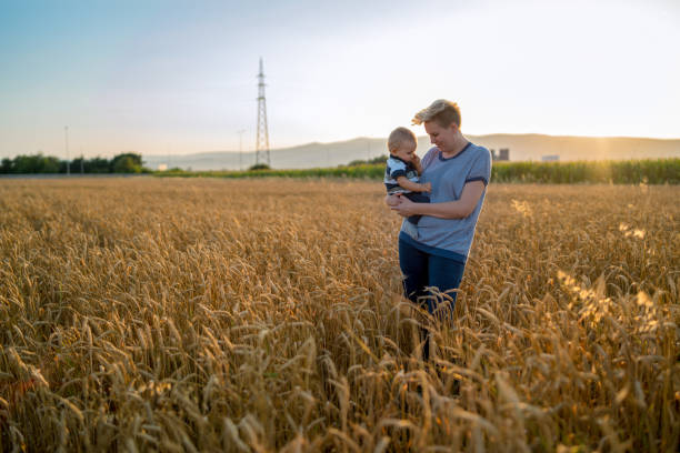 istock Mother and little son in a wheat field 1495774716