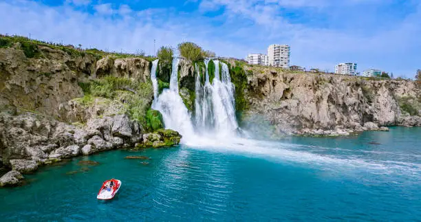 The more famous Karpuzkaldiran Lower Düden Waterfall roars down into the sea from the 50 m high cliffs in Antalya Lara district.

The Düden river falls from the 40 meter high cliffs of Antalya by the sea for the second time, creating the picturesque natural spectacle. The force of the falling water is noticeable in the cool draft around the waterfall. You can even feel it on the top of the cliffs.