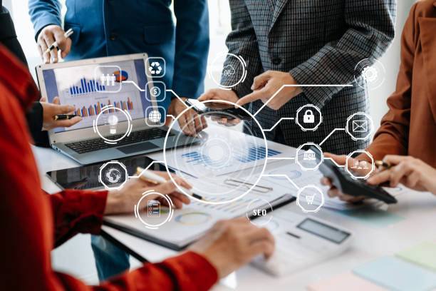 istock Working team meeting concept, business using laptop and smart phone and digital tablet computer with digital marketing media  in virtual icon network diagram office 1495785881